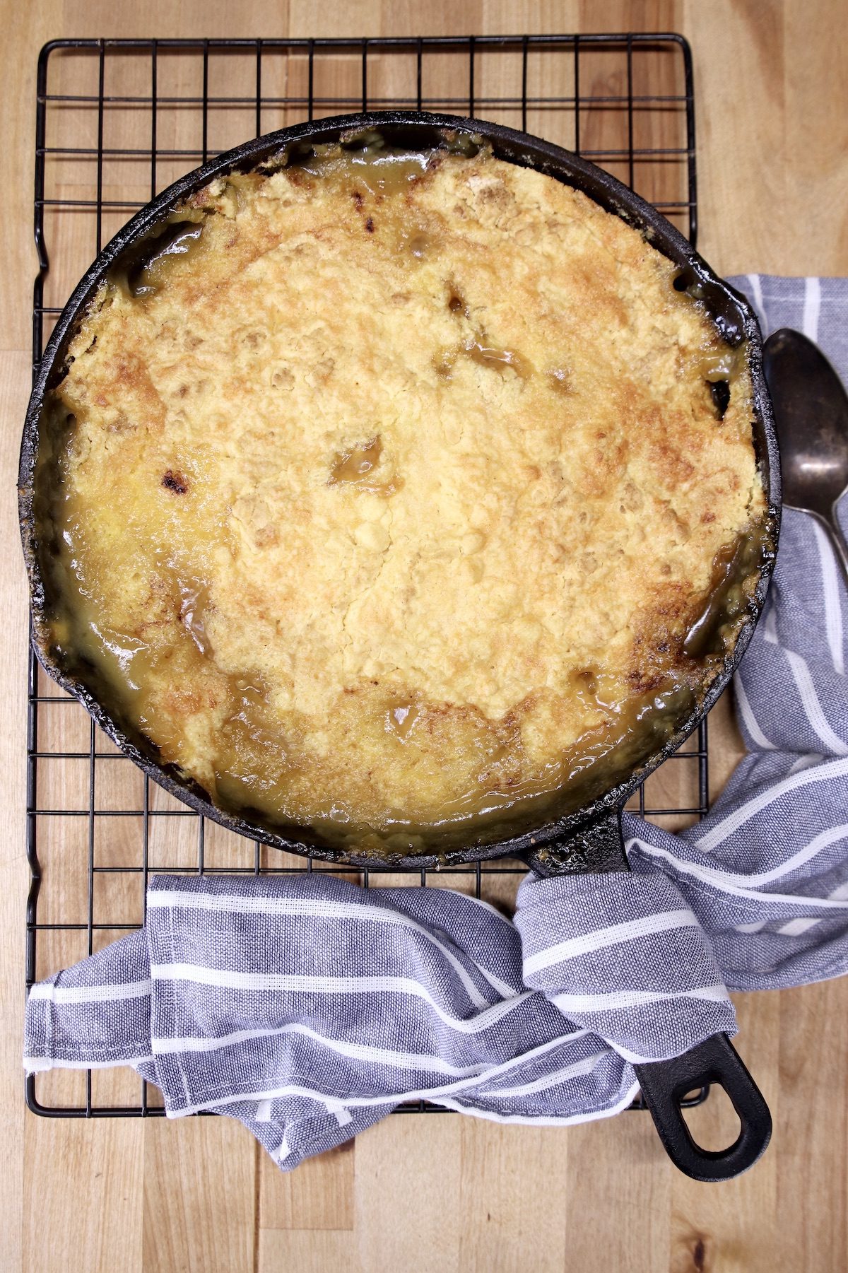 skillet peach cobbler on a wire rack