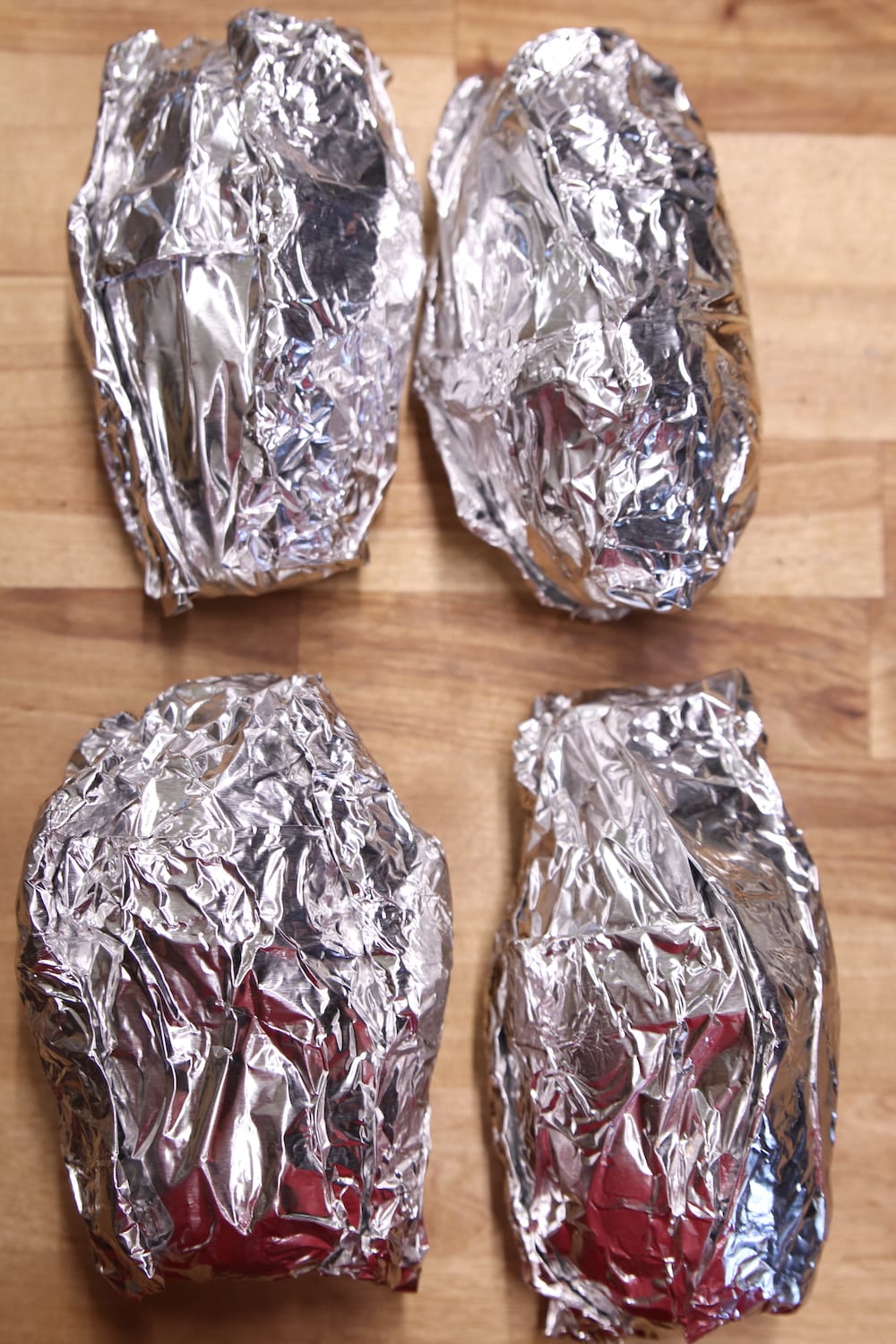 4 foil packets of baked potatoes