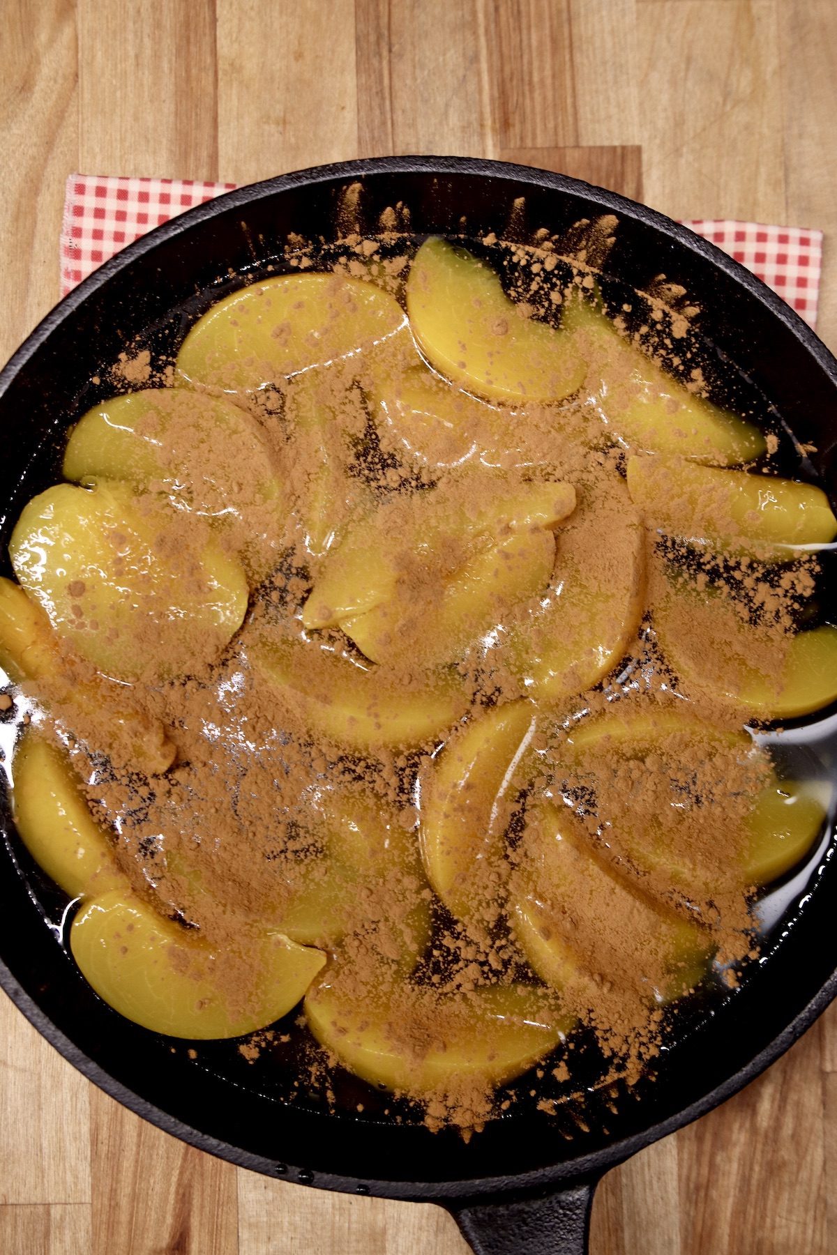 cinnamon topped peaches in a skillet