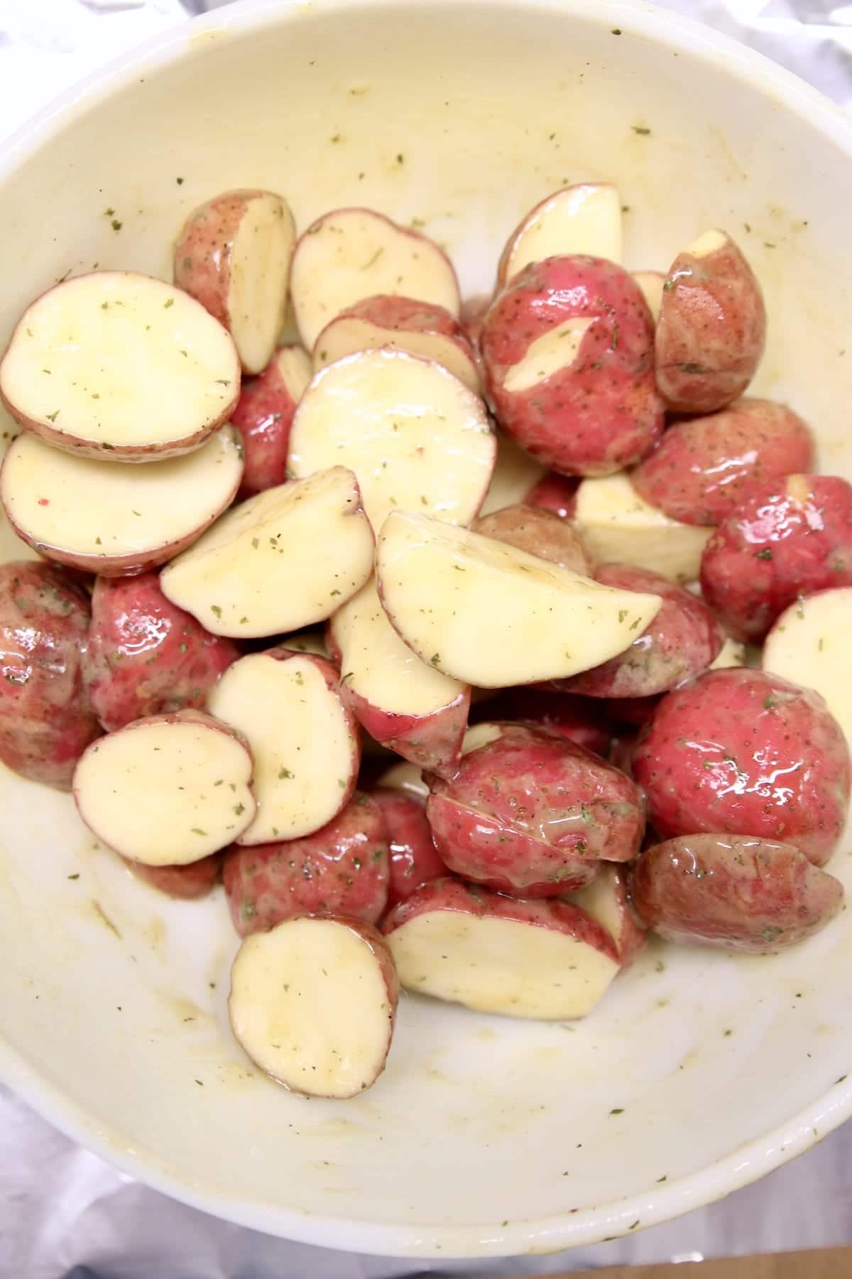 bowl of cut baby potatoes with seasonings