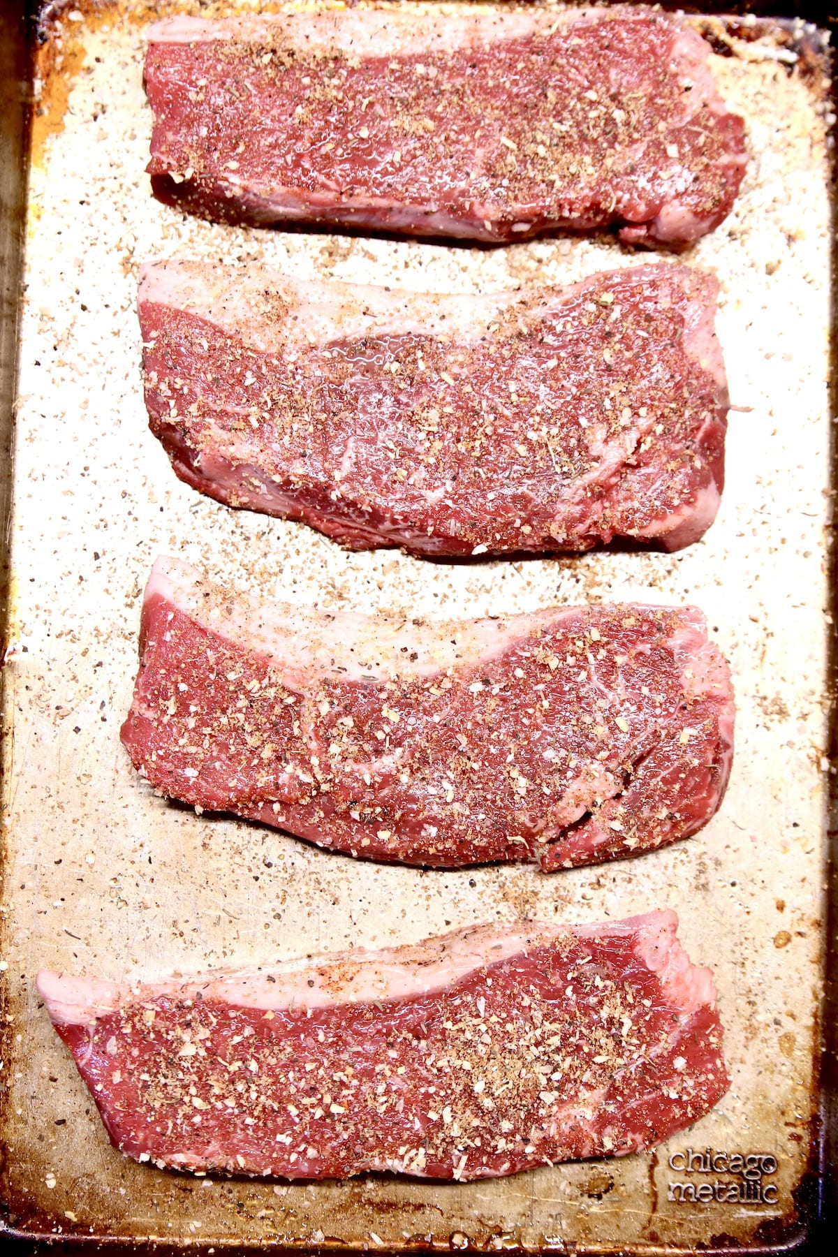 4 NY Strip Steaks with dry rub ready to grill