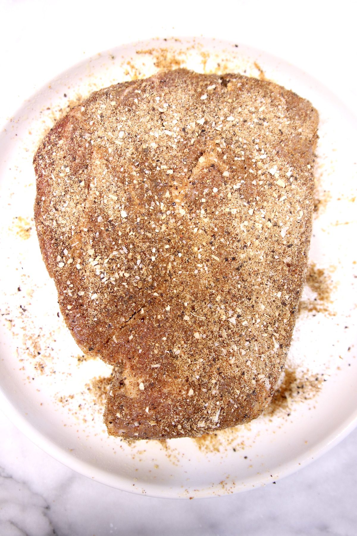 chuck roast with dry rub seasoning read to grill