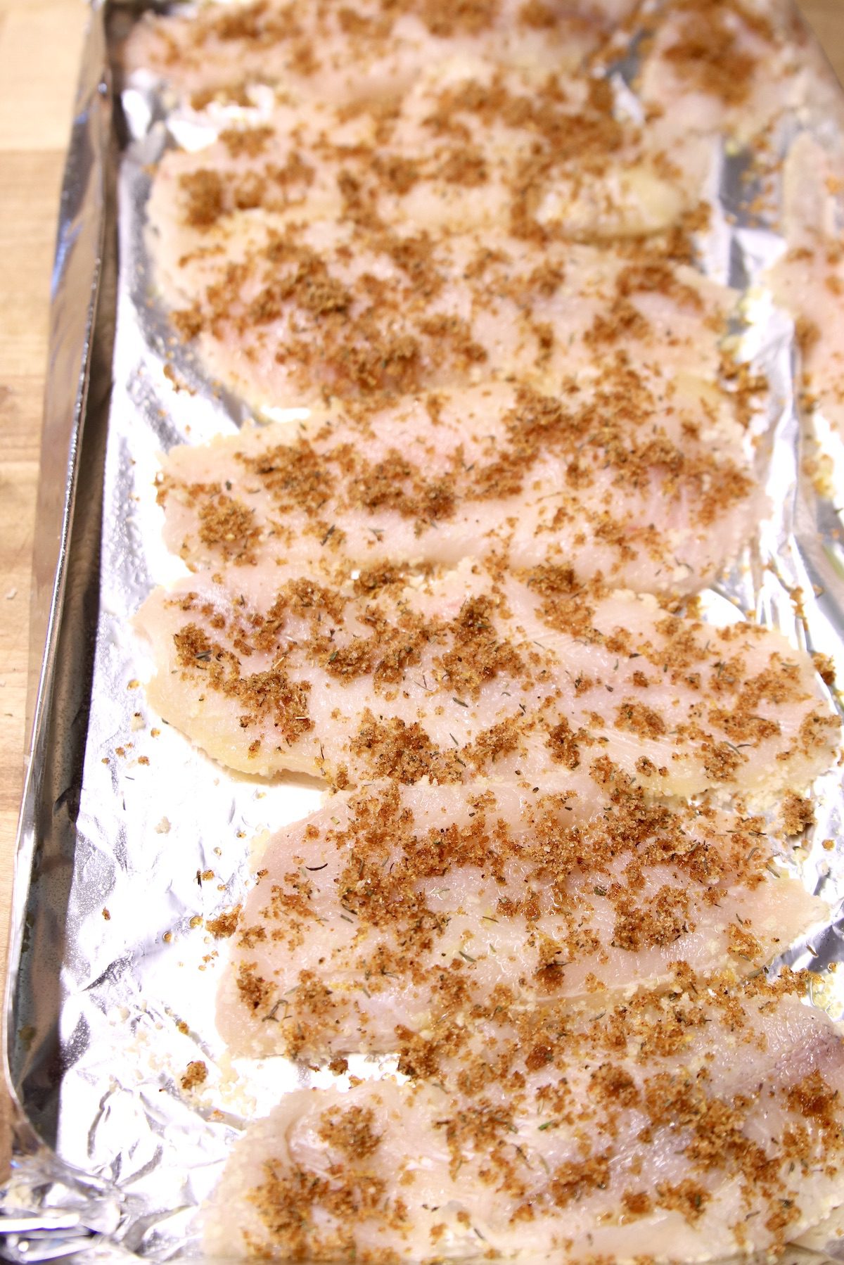 catfish filets on foil sprinkled with brown sugar rub