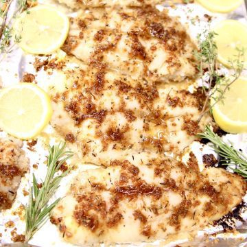 lemon grilled fish on foil with lemons and thyme
