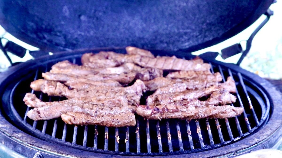 grilling steak tips on a grill