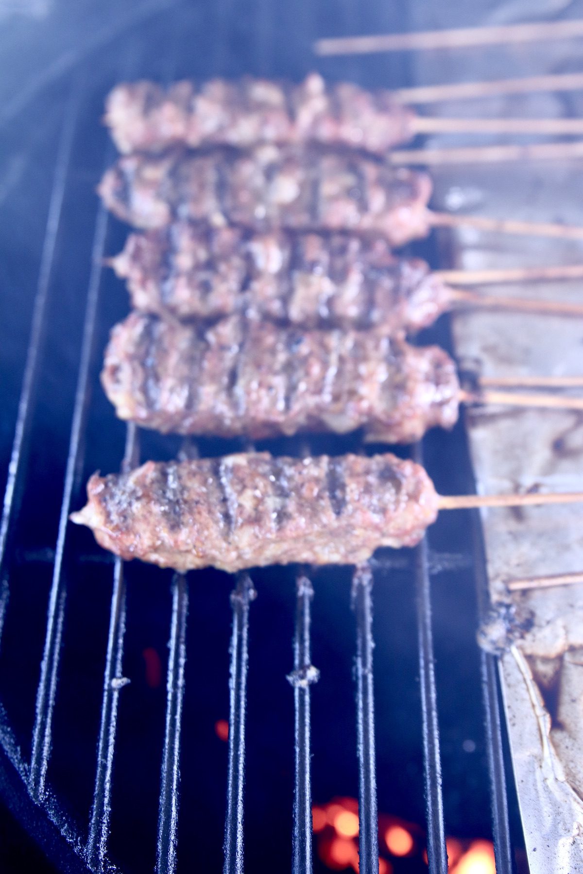 closeup of ground beef kabobs on a grill