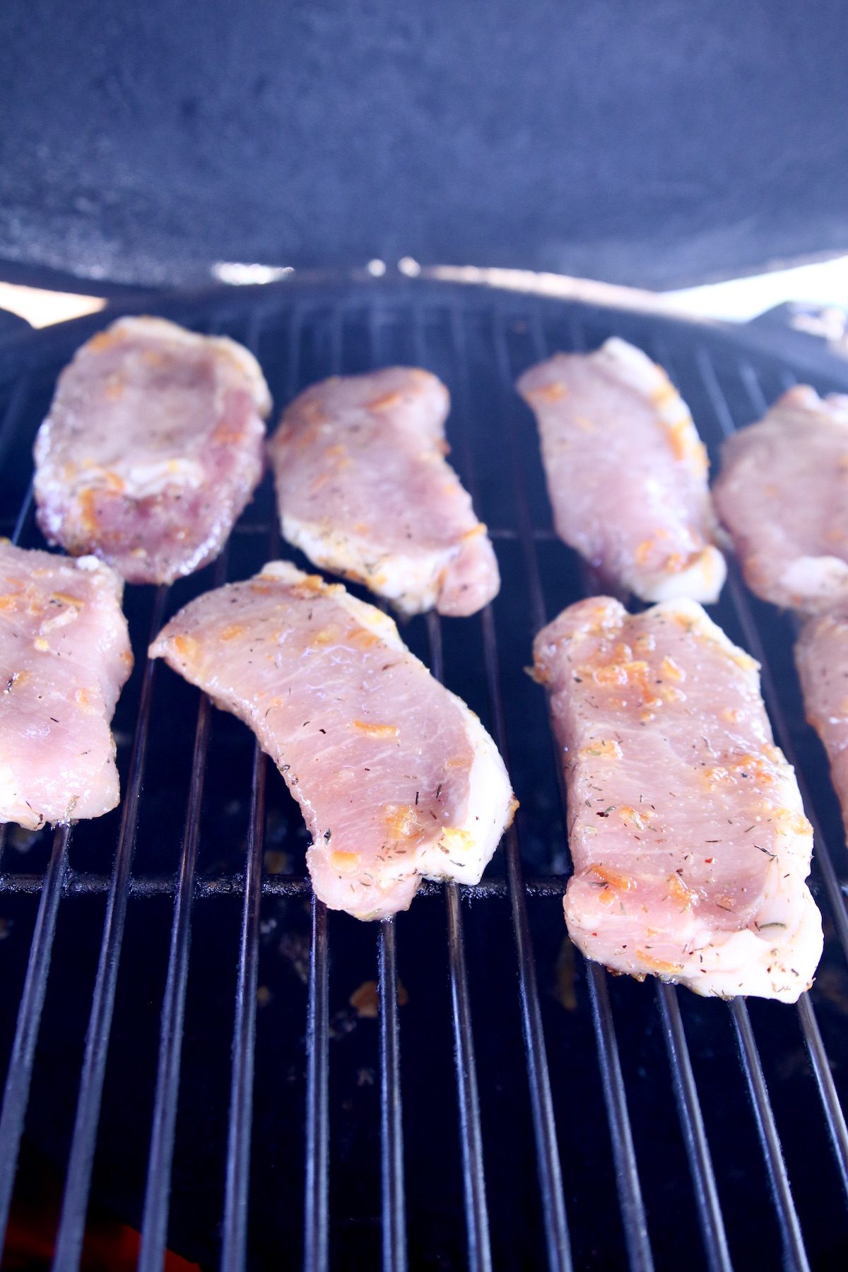 marinated pork chops on a grill