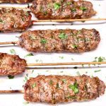 ground beef skewers on a platter