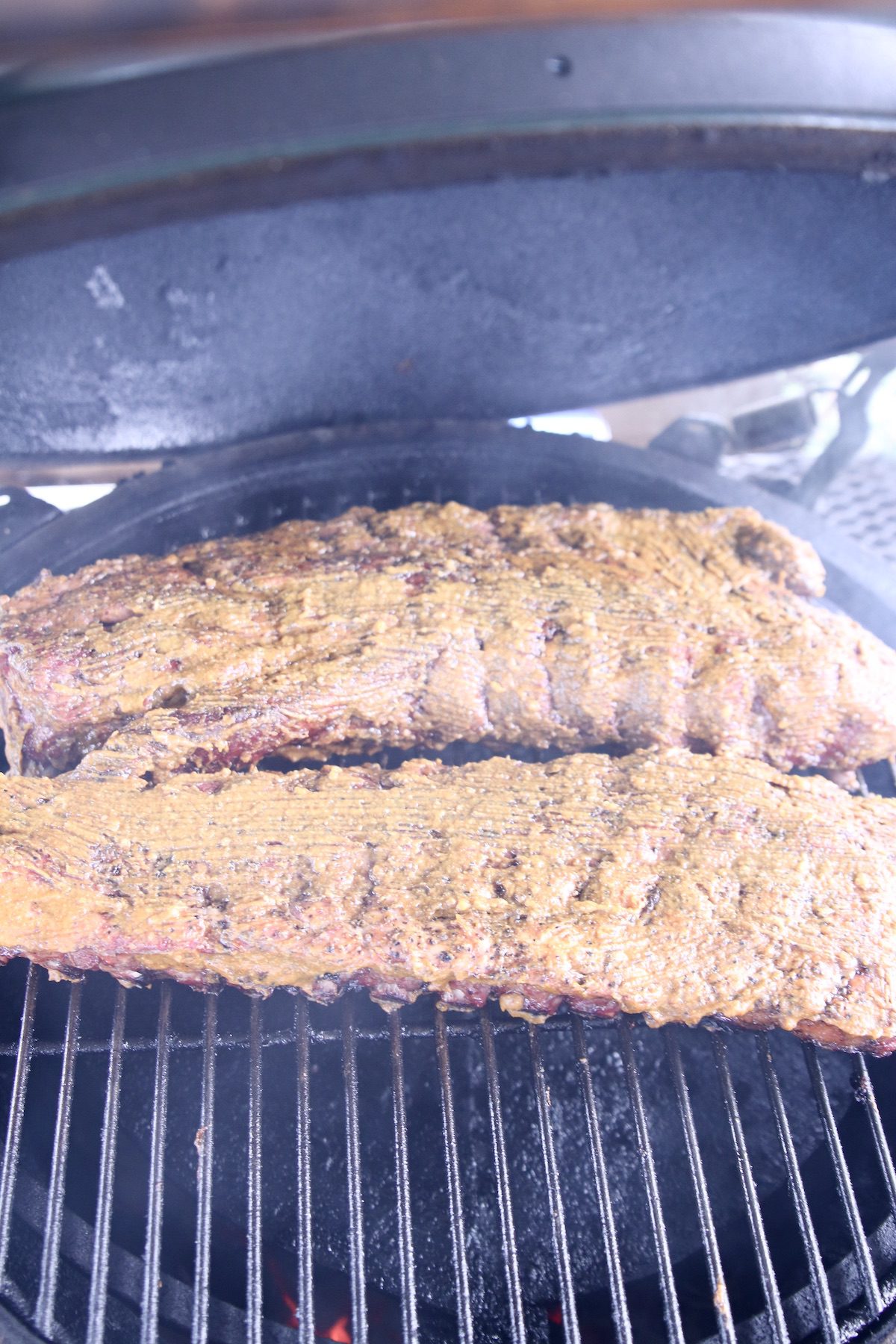 mustard rubbed ribs on a grill