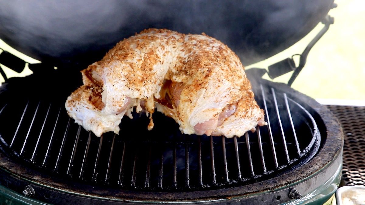 spatchcocked turkey on a grill