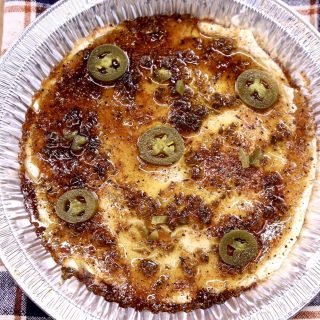 cream cheese dip with jalapenos in a foil pan