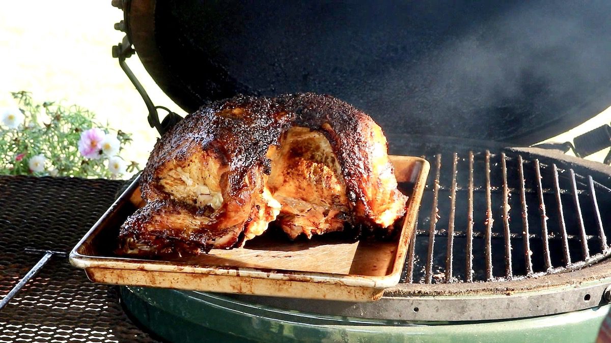 smoked turkey on a baking sheet - sitting on grill