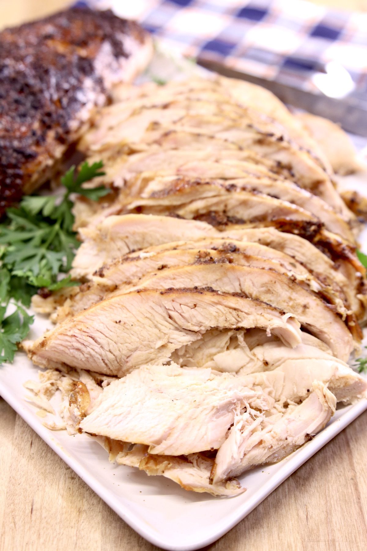 sliced smoked turkey on a platter