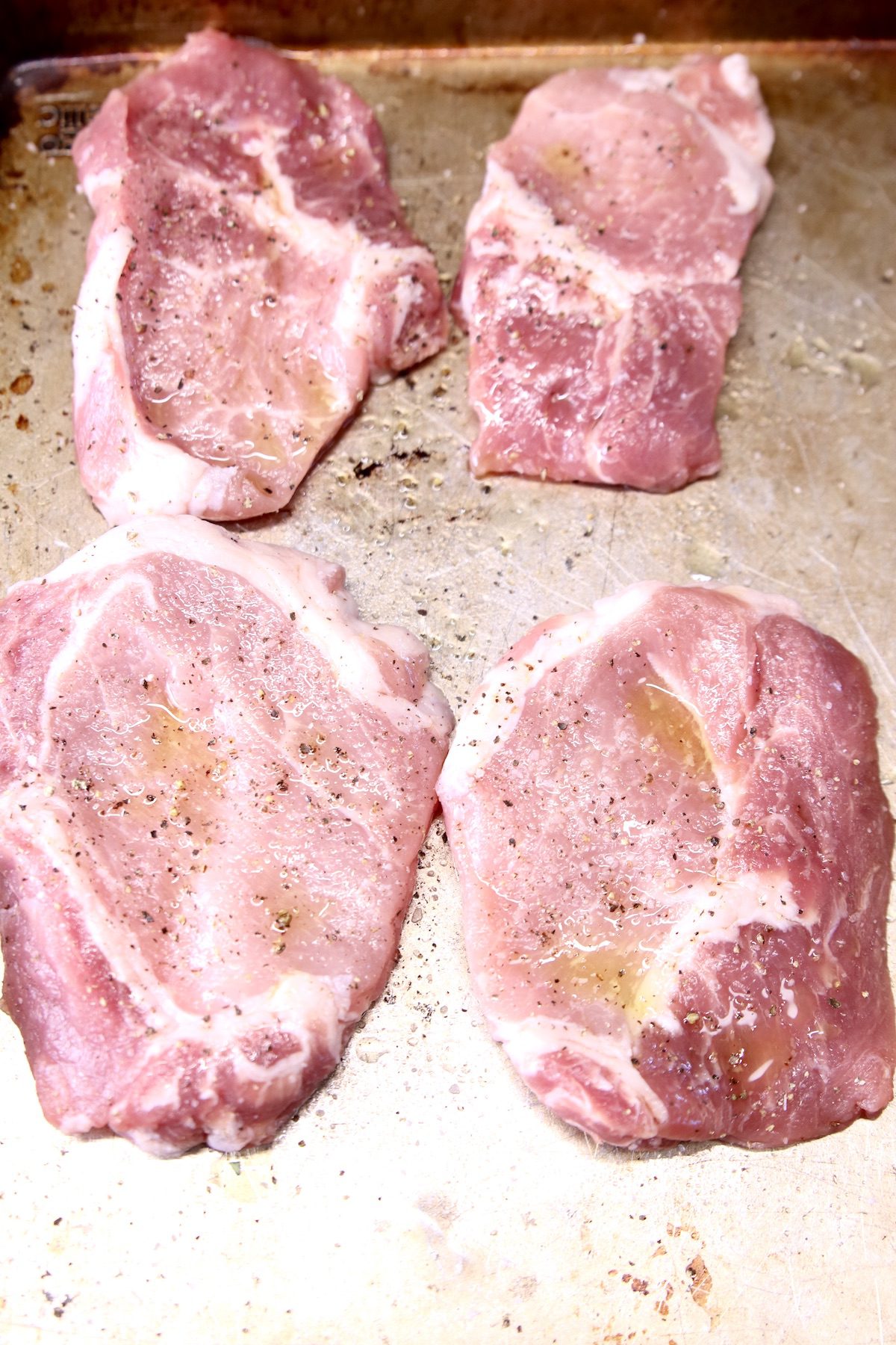 pork chops on a sheet pan - uncooked