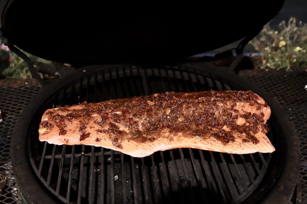 salmon fillet with toasted garlic butter on a grill