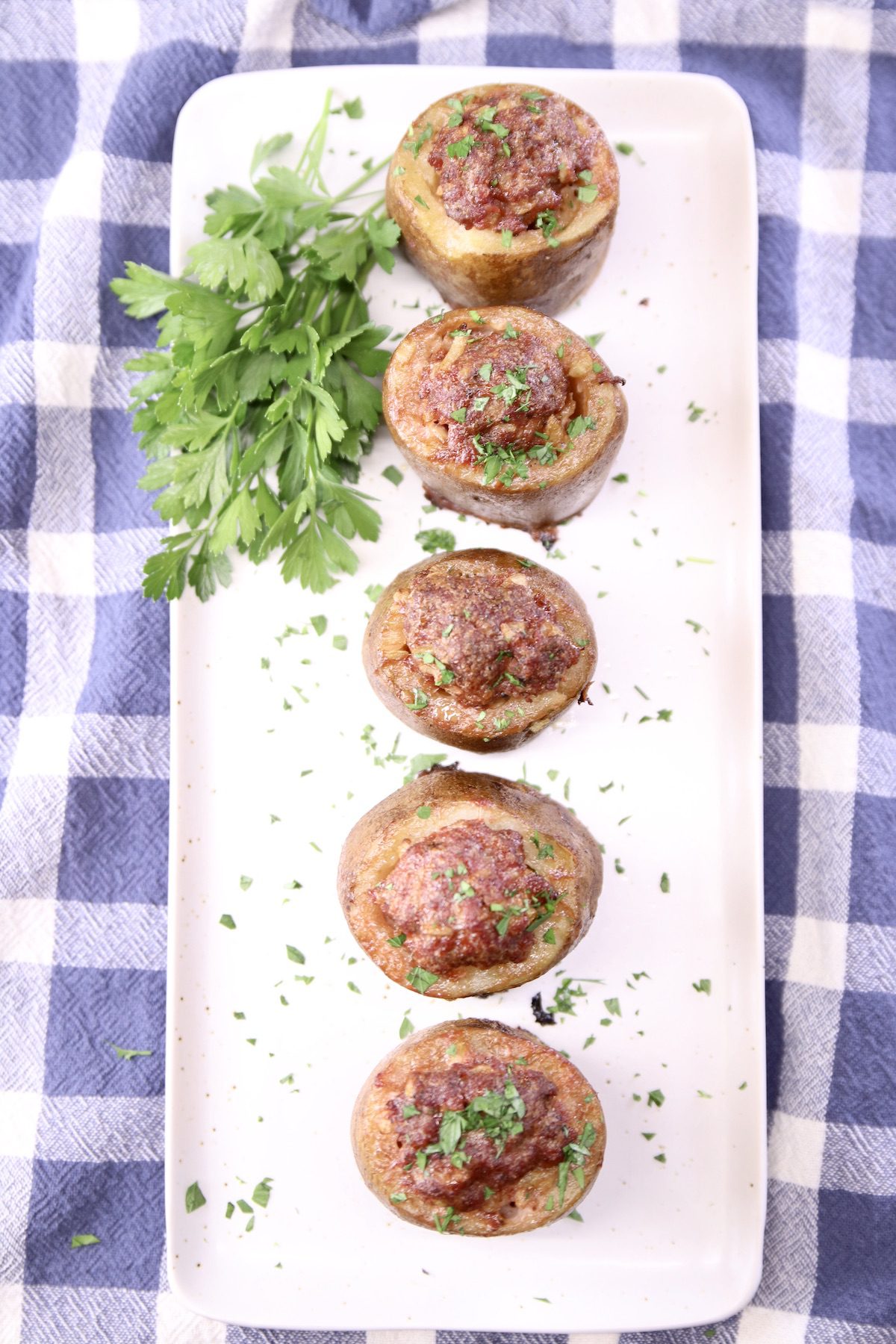 ground beef meatloaf stuffed potato shots on a white platter