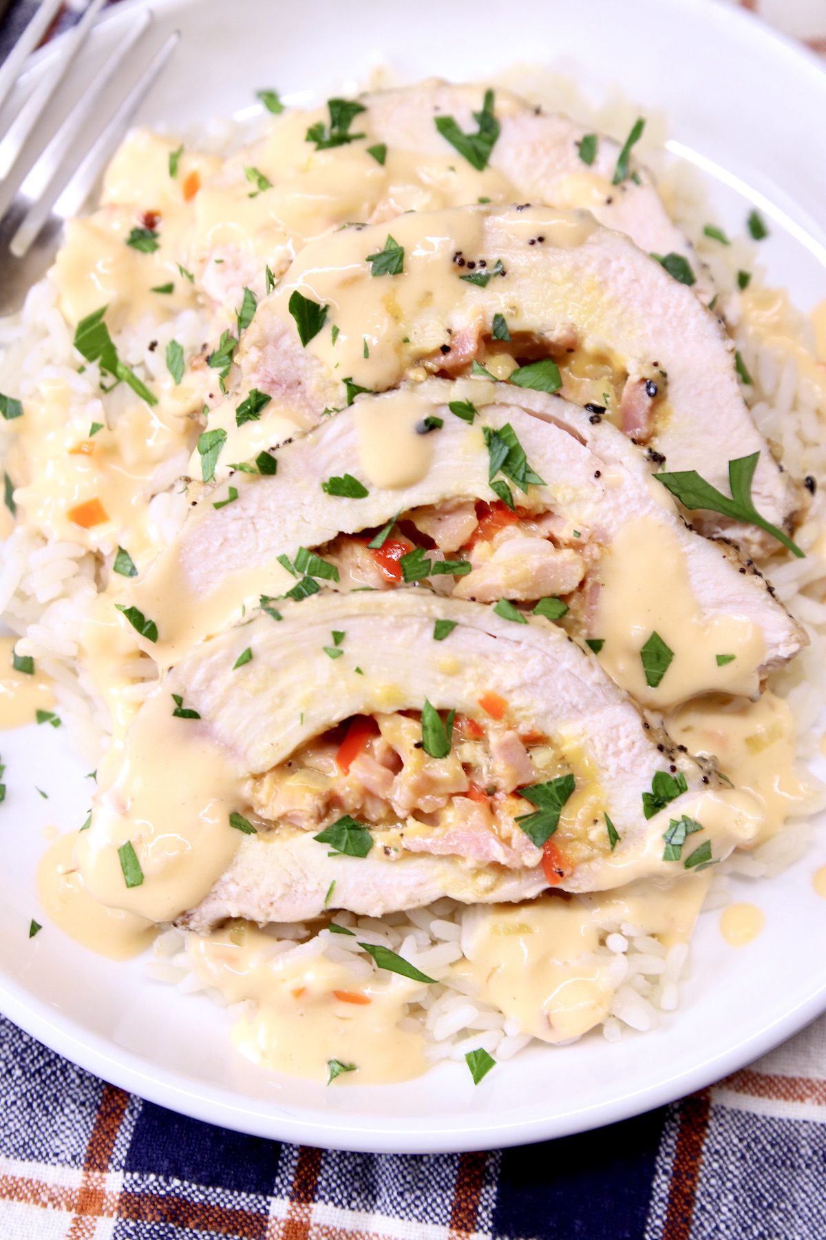closeup of sliced chicken stuffed with ham and cheese