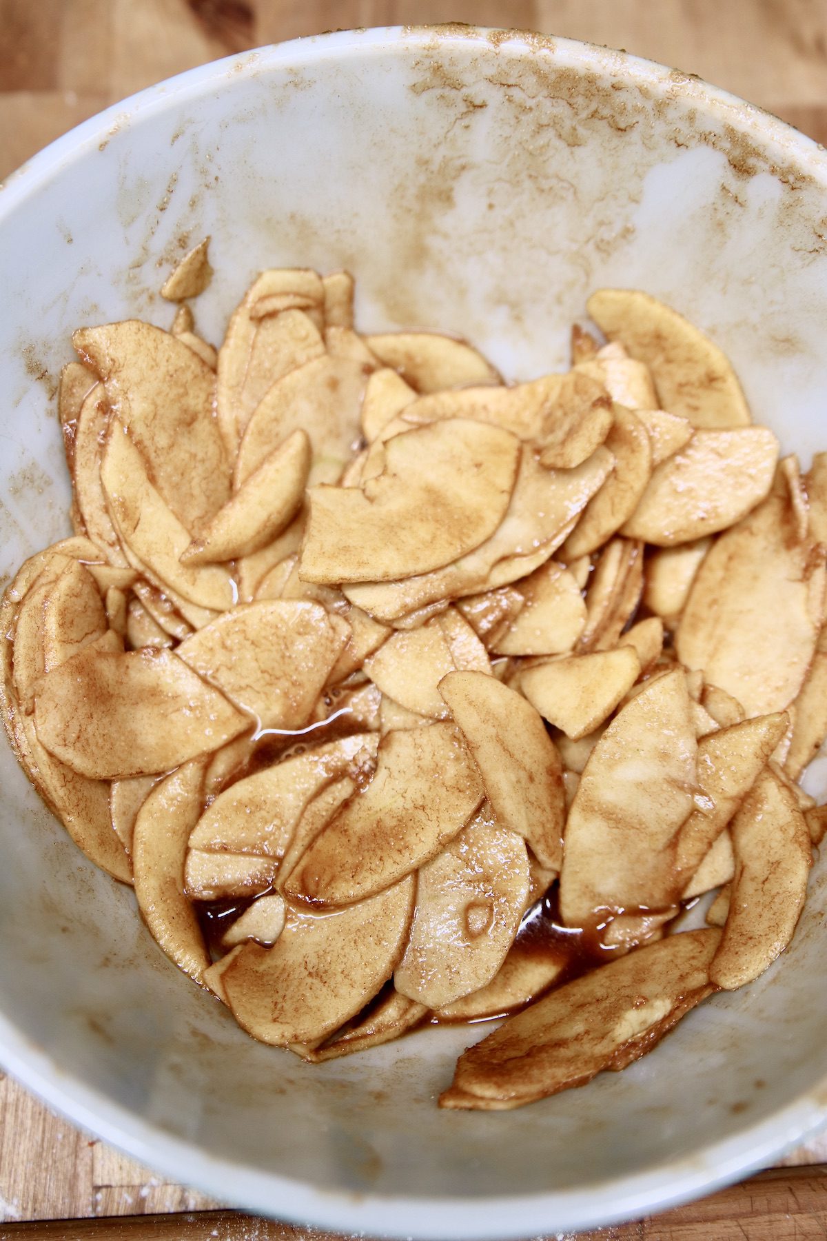 sliced apples with cinnamon and brown sugar in a bowl