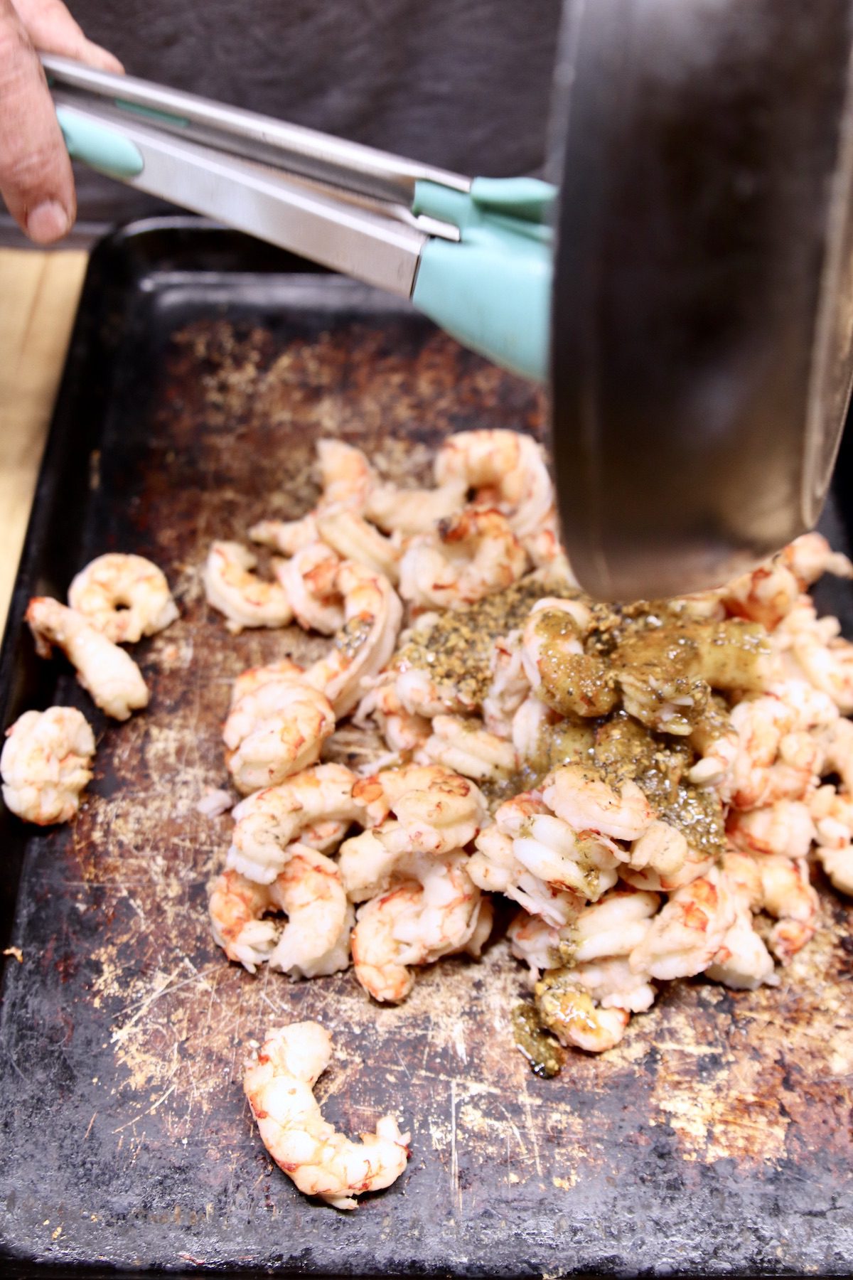 pouring garlic butter over shrimp