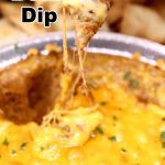 cheesy bean dip scooping with tortilla chip - text overlay