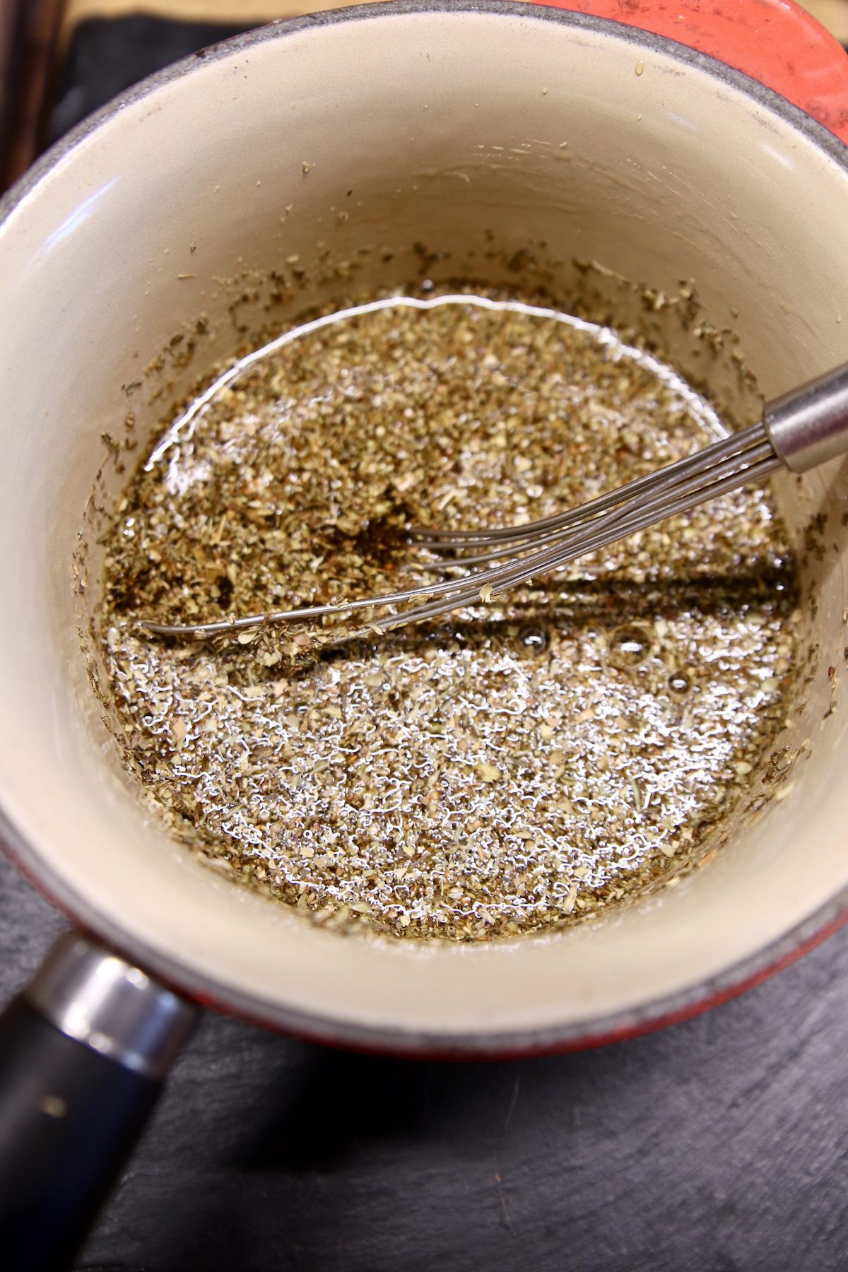 coffee marinade in a pan with whisk