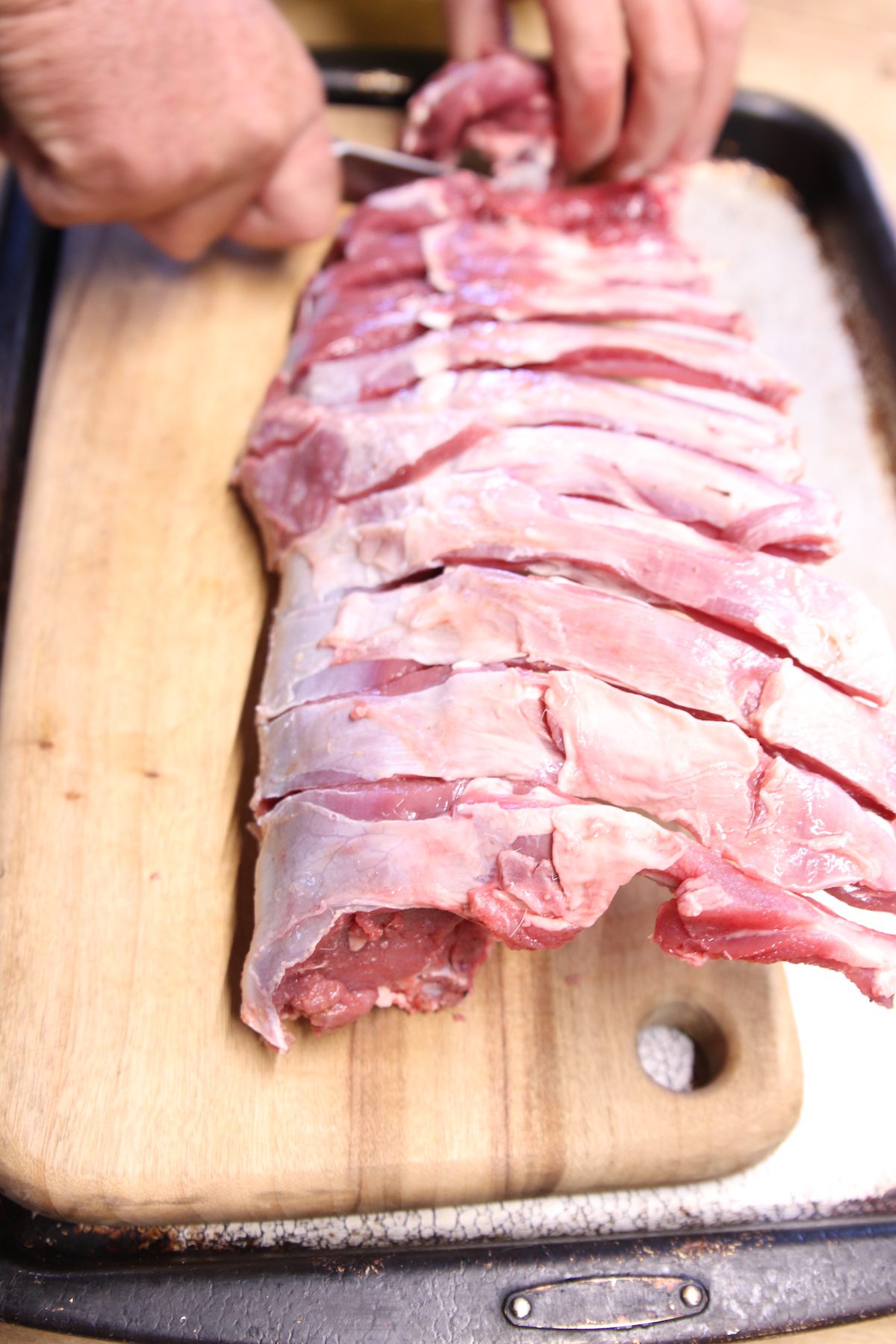 slicing venison rib rack into chops