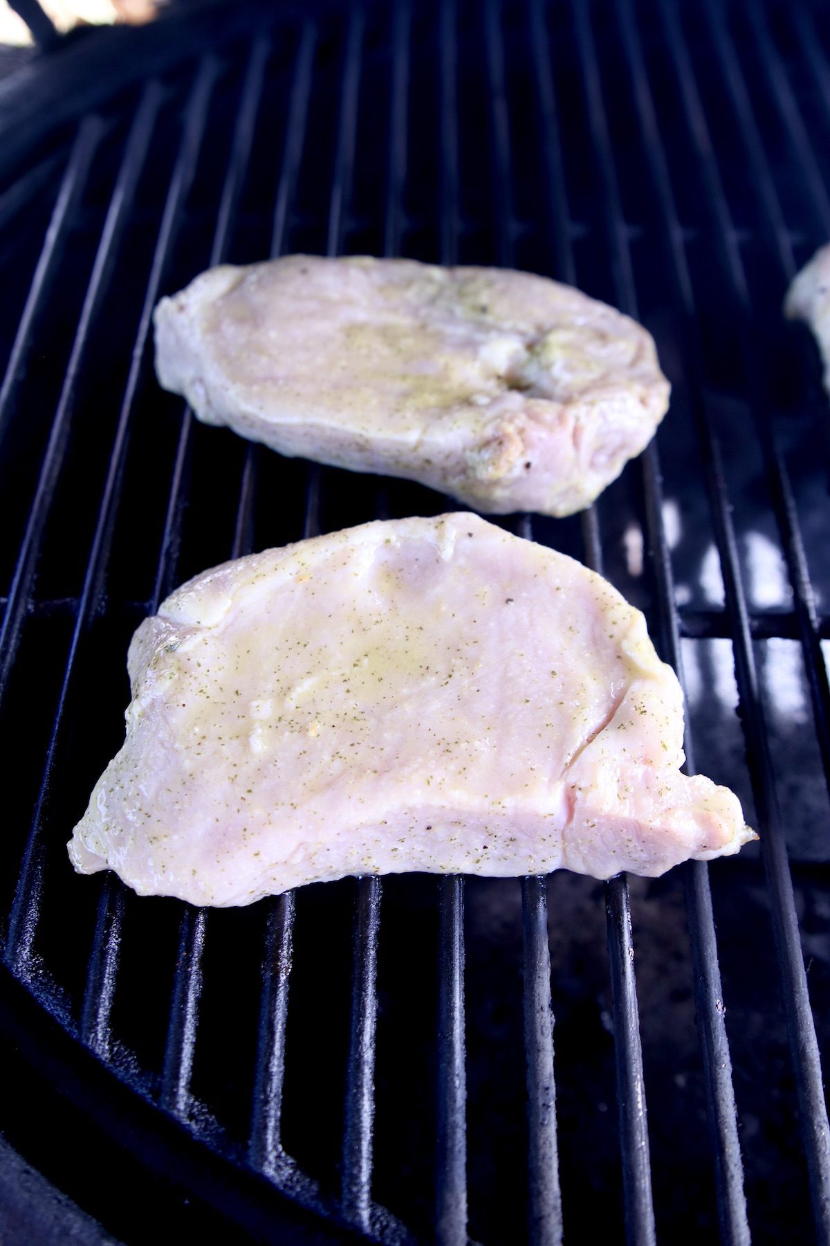 marinated pork chops on grill
