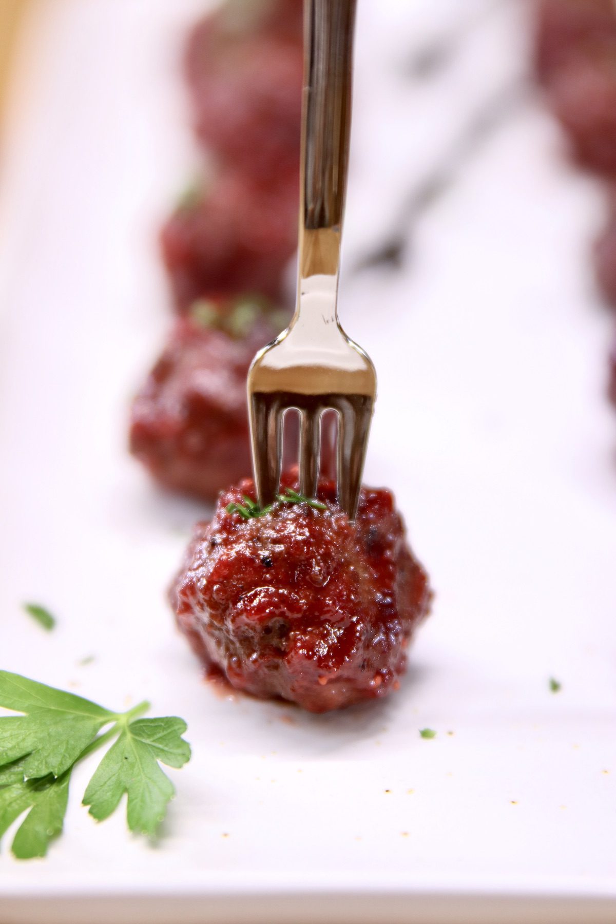 Grilled Cranberry Meatball on a appetizer fork