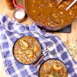 shrimp stew in 2 bowls, dutch oven - text overlay