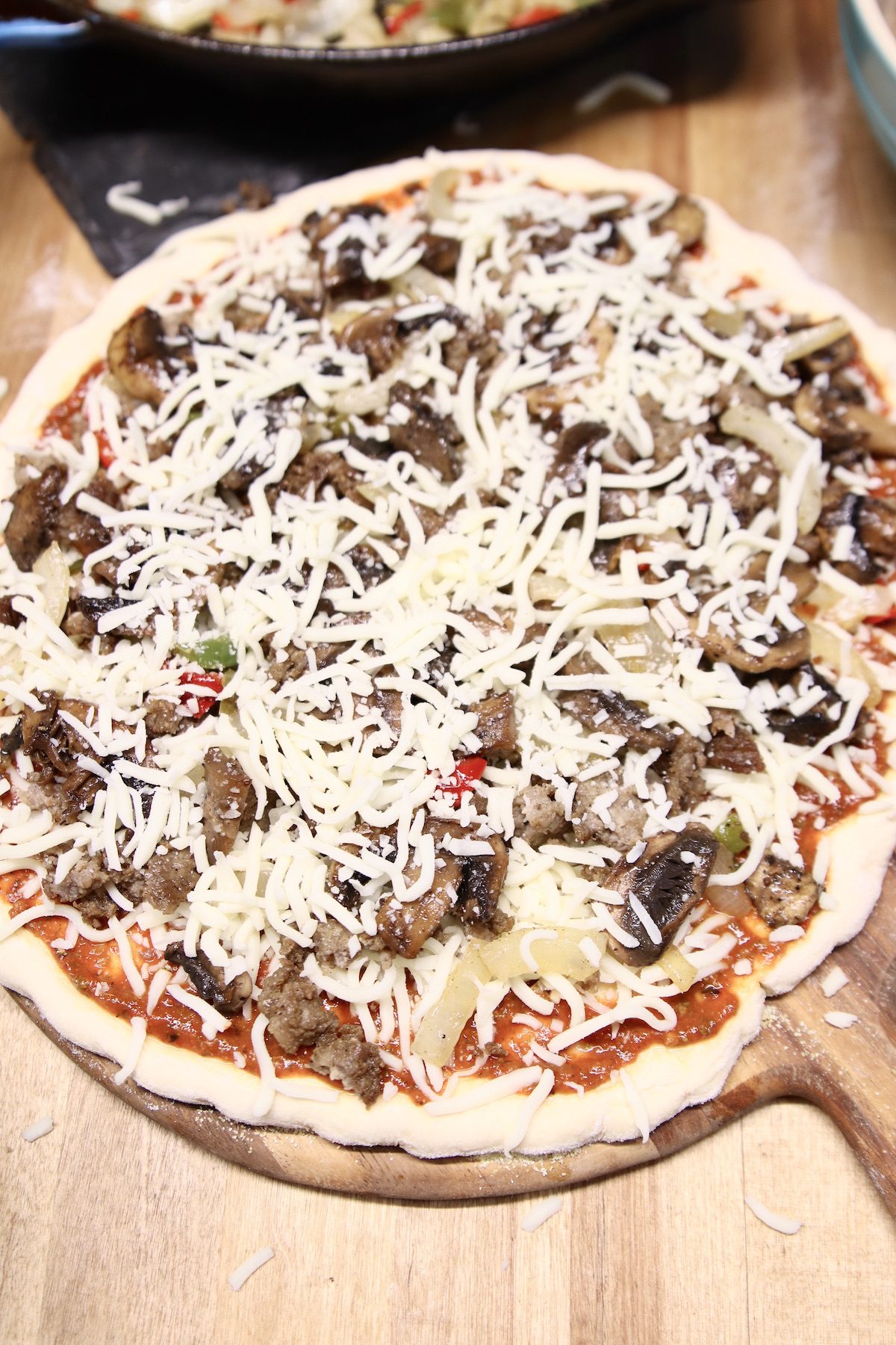 pizza with mushrooms ready to grill