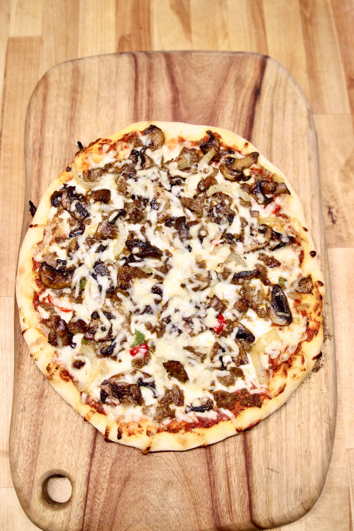 pizza with sausage, mushrooms and peppers