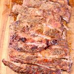 grilled spare ribs -sliced on a cutting board