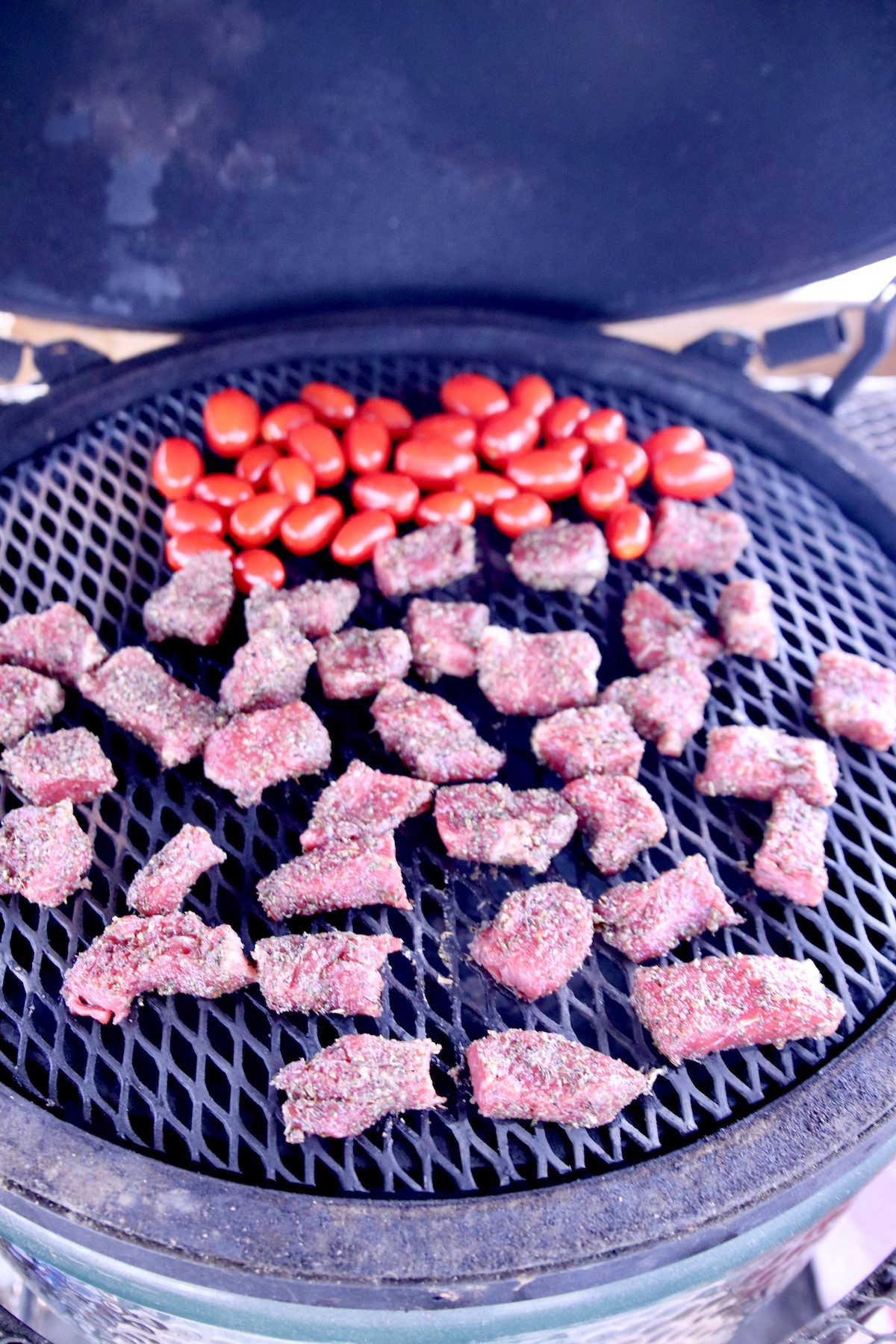 grape tomatoes and steak bites on grill