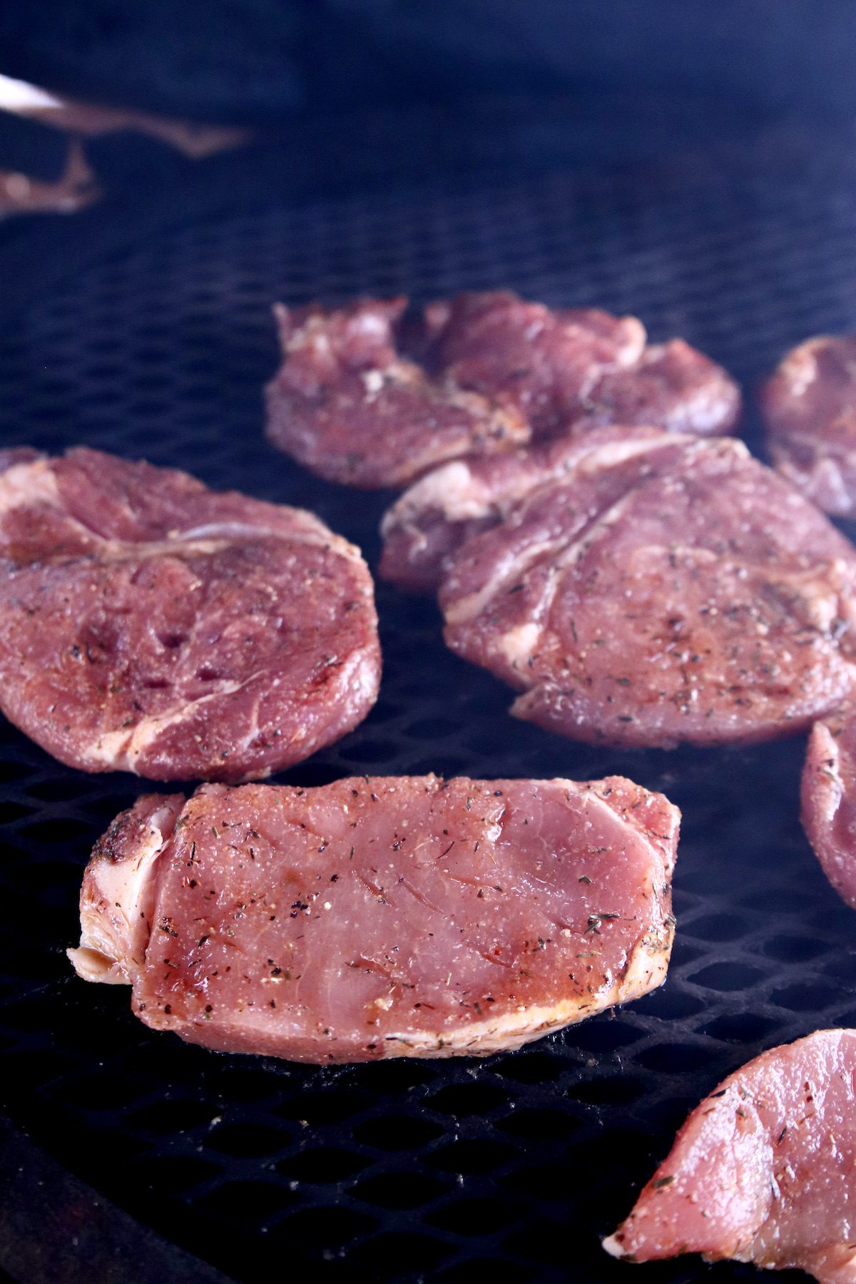 cooking pork chops on a grill