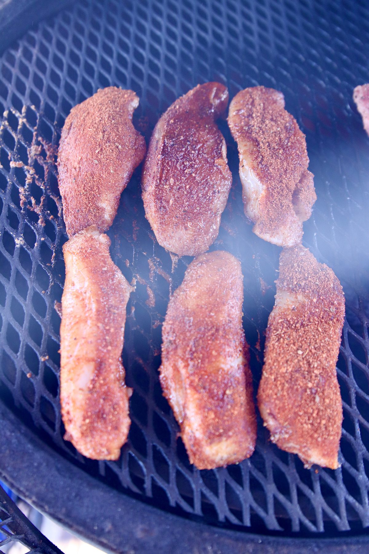 chicken tenders on a grill.