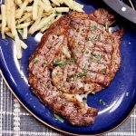 Grilled Steak o a plate with fries