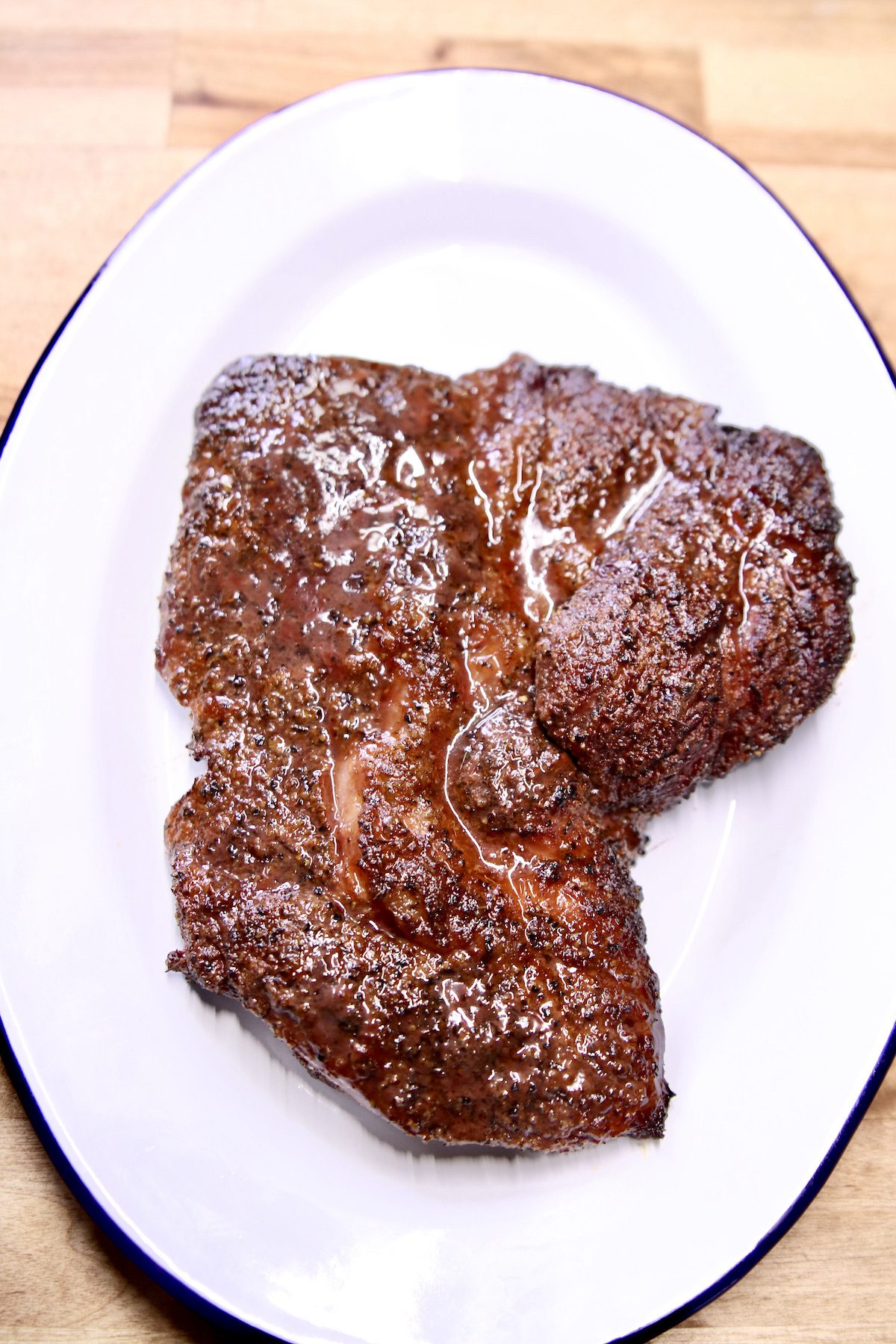 grilled chuck steak on a platter