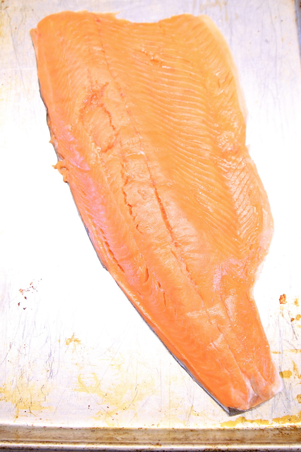 salmon fillet on a sheet pan.