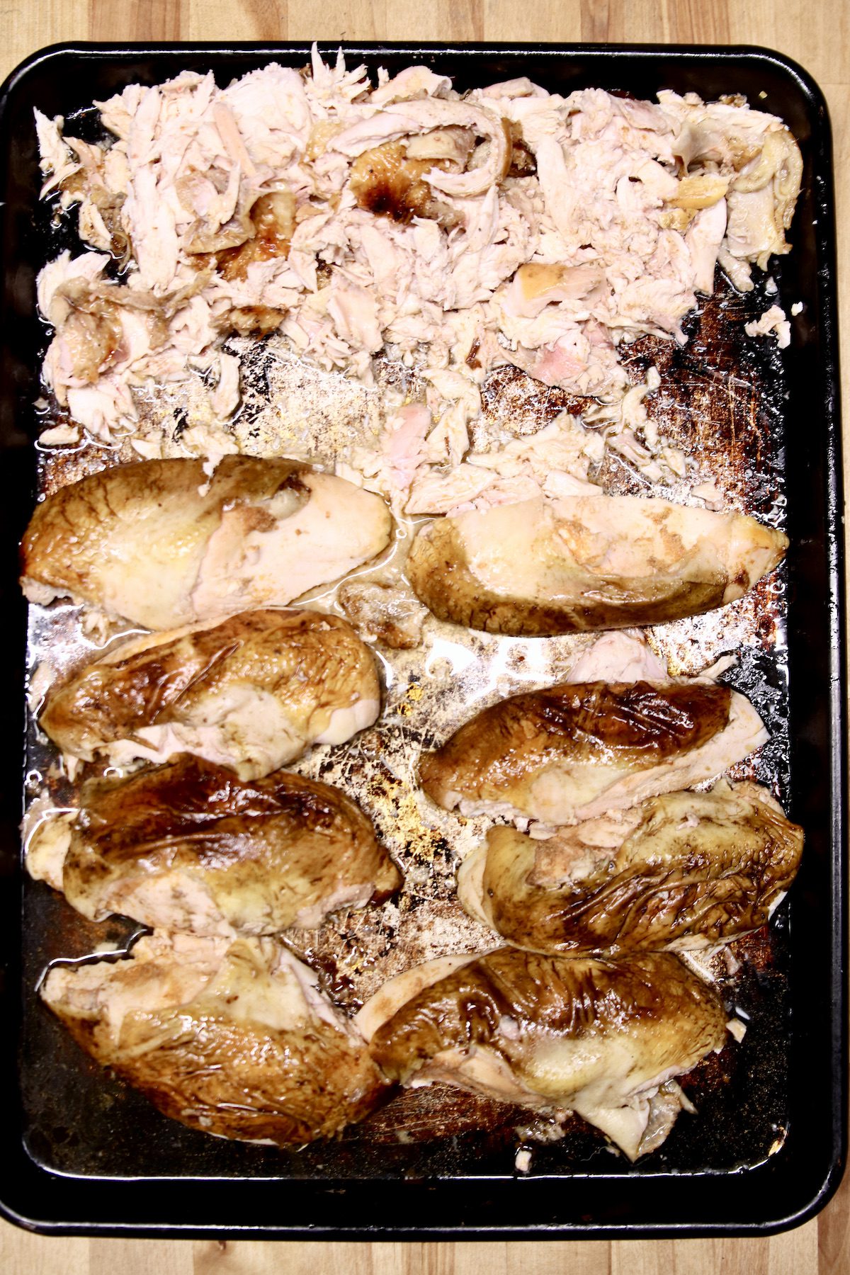grilled chicken breasts on a sheet pan