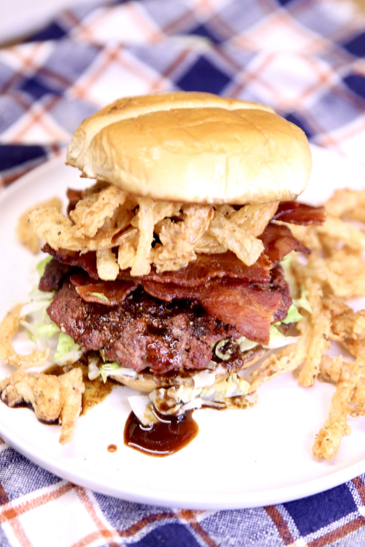 Steakhouse burger with bacon and onion strings.