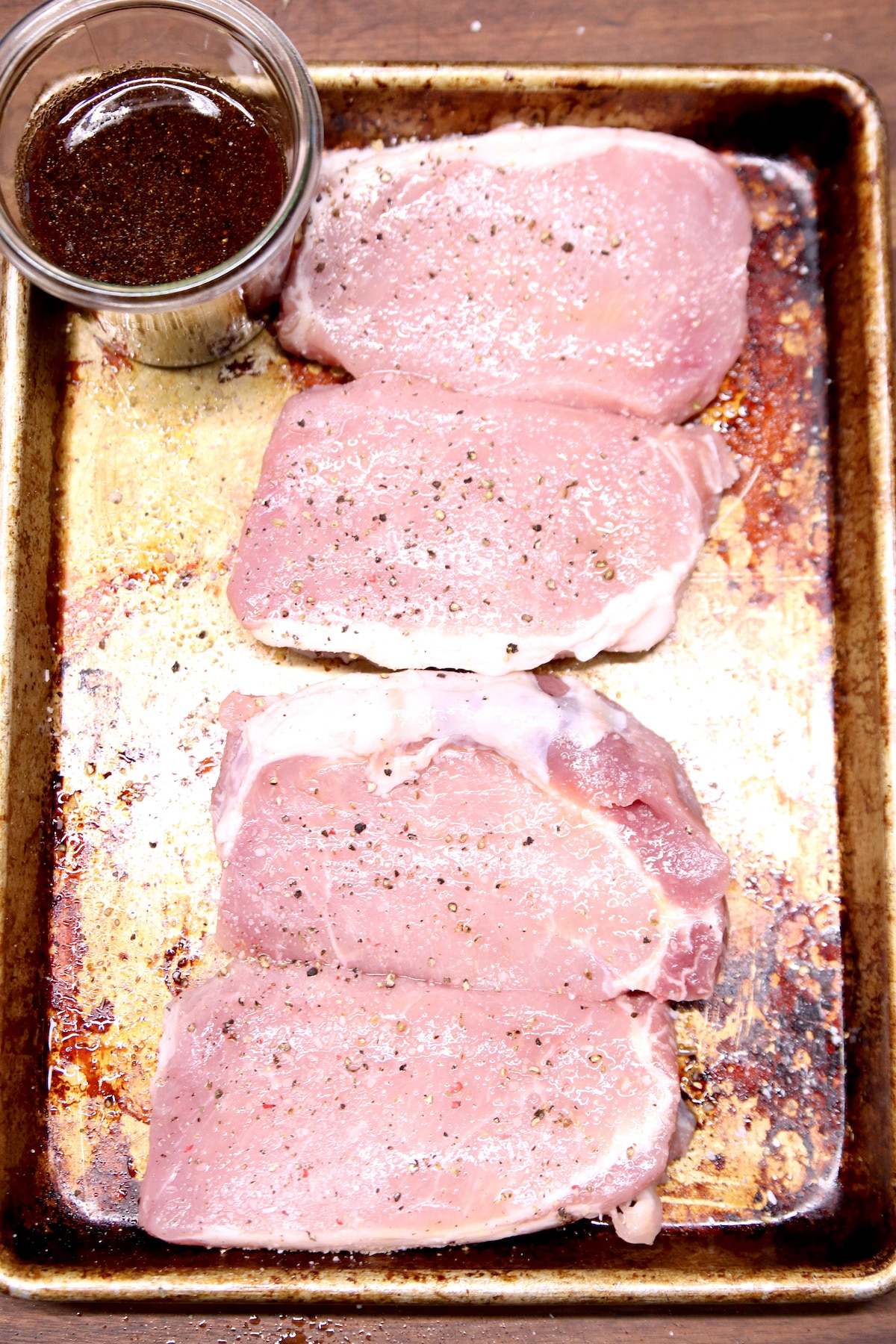 sheet pan with maple glaze in a jar, 4 raw pork chops.
