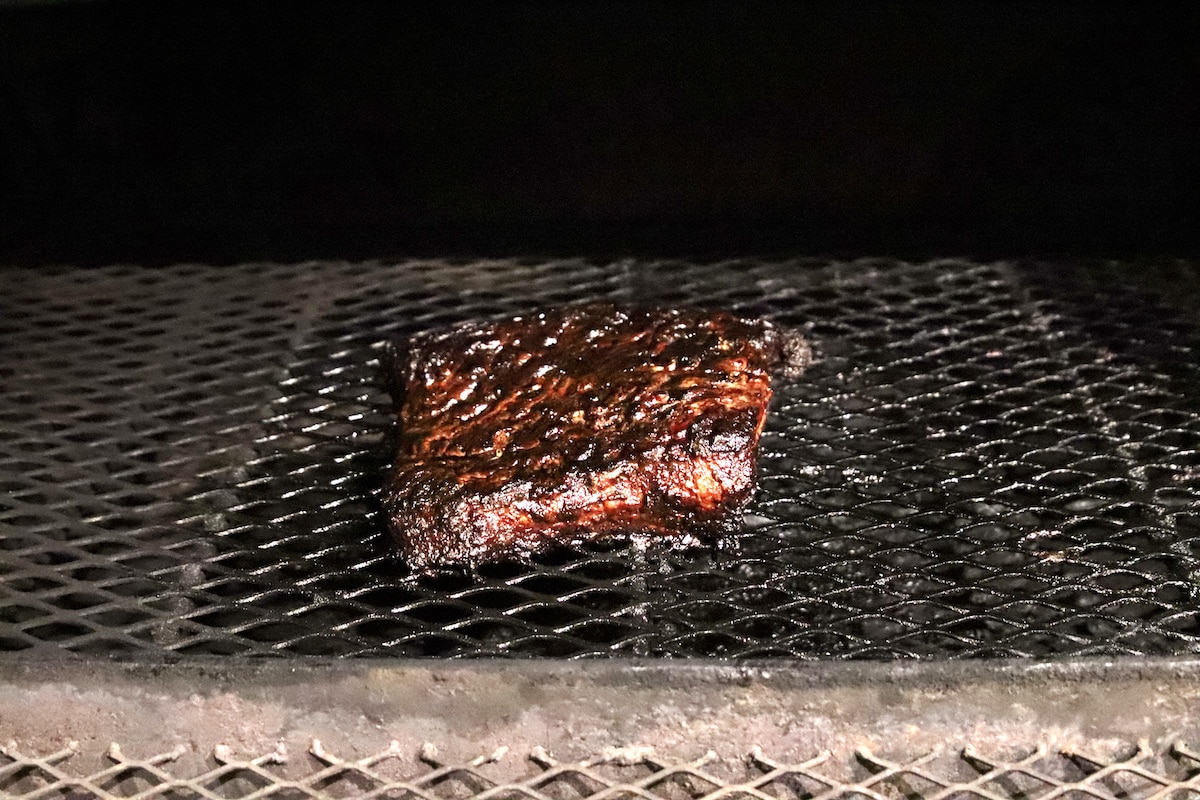 brisket flat smoked on a grill.