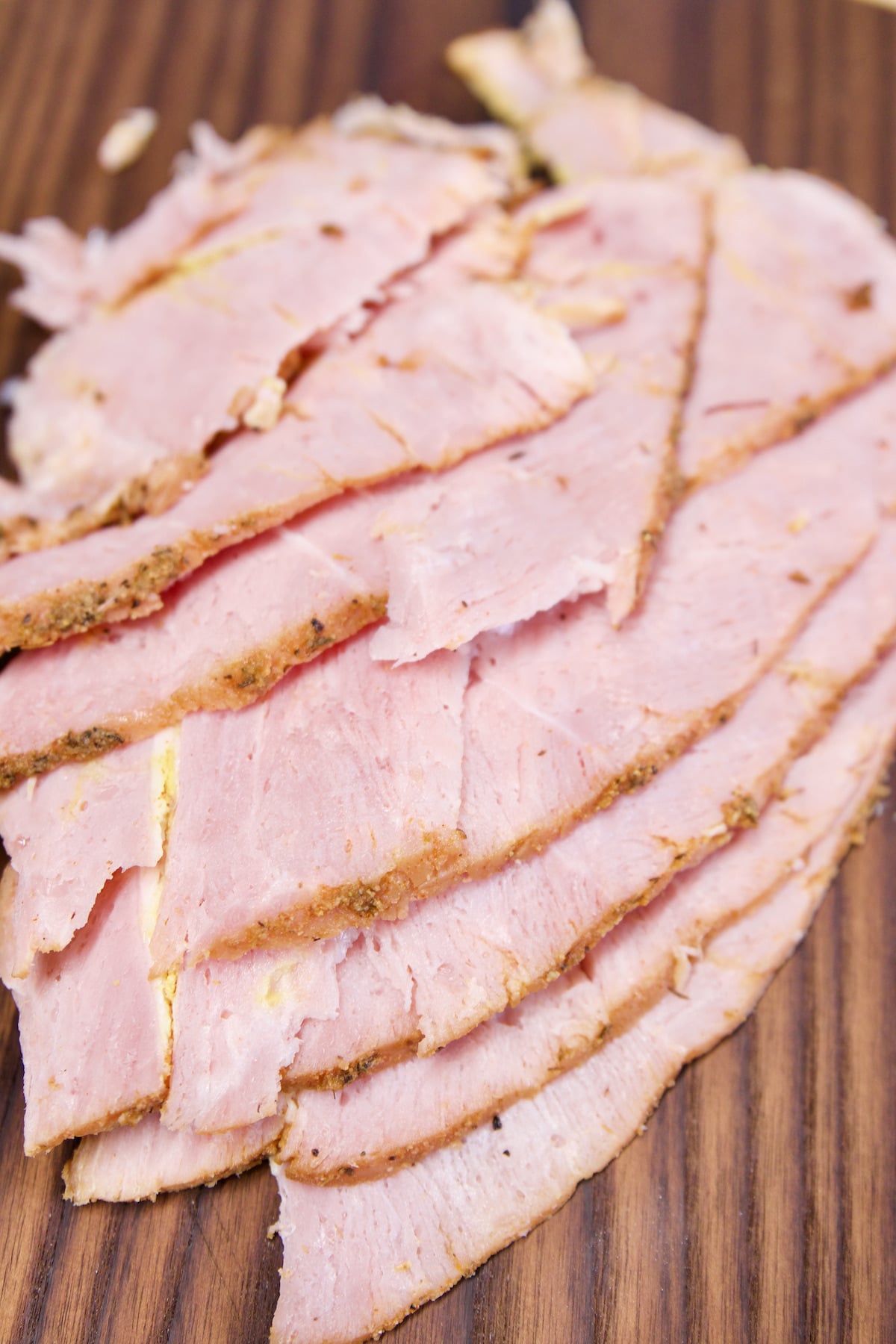Sliced ham on a cutting board.