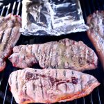 Pork steaks on a grill - text overlay.