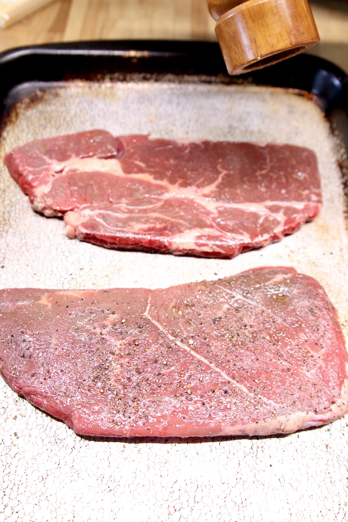 seasoning sirloin steak for grilling.