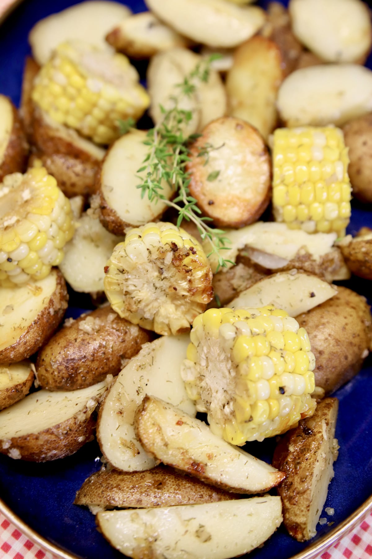 Grilled Potatoes with corn on the cob.