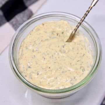 Garlic Cream Sauce in a small bowl with spoon.