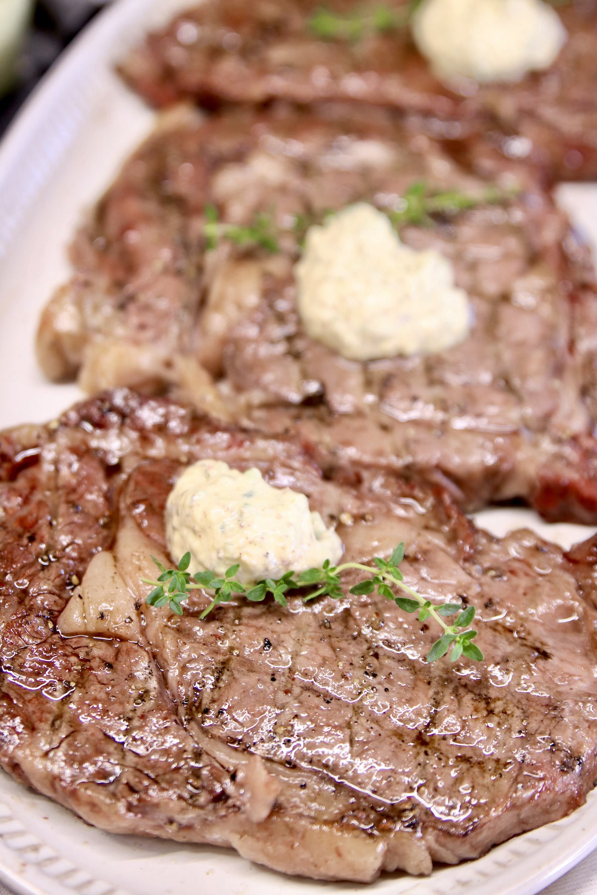 Grilled steaks with garlic cream sauce.