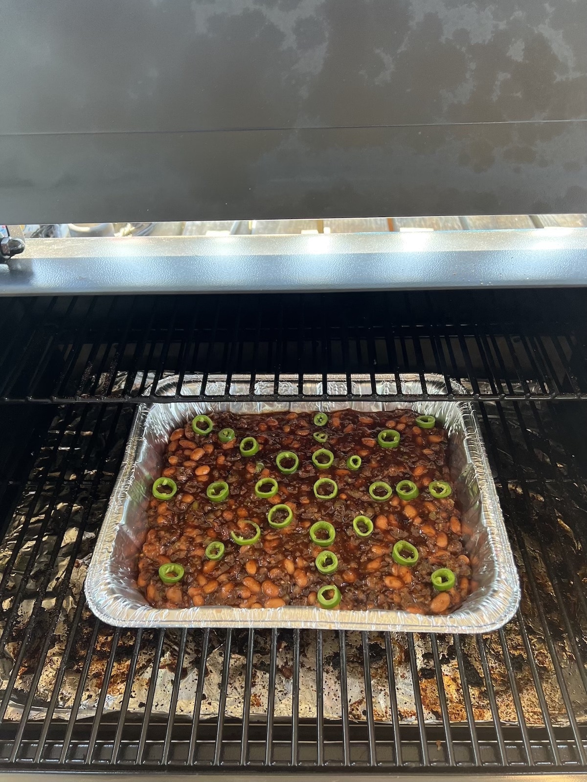 BBQ beans on a grill.