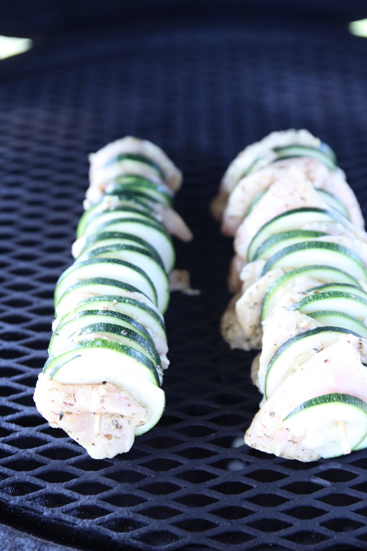 Grilling skewers with zucchini and chicken.
